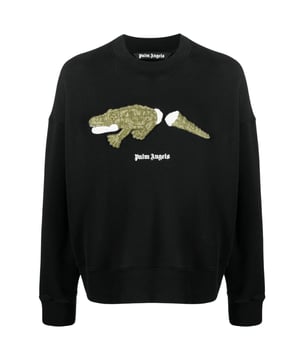 Ervaar behaaglijk comfort en casual verfijning met de Palm Angels zwarte trui met ronde hals. Deze ultrazachte trui is versierd met een stijlvol logo en is ontworpen om de hele dag warmte en tijdloze stijl te bieden. Maak een statement met deze relaxed-fit trui, perfect voor dagelijks gebruik!, Merklogo op de voorkant, Croc-ontwerp op de voorkant, Normale pasvorm, Zwarte Palm Angels-trui, Elastische taille en mouwuiteinden, Opgestikt merklogo op de voorkant CLG-codeauthenticatie, Ronde hals , Street chic, lange mouwen, 100% katoen, gemaakt in Italie, trui van krokodillensplit, elastische taille en mouwuiteinden, klassiek merklogo