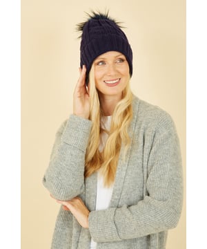 Pull on the pom poms this season this with Yumi Cable Knit Hat. Super warm and cosy, this hat comes in a classic navy cable knit with a super soft pom pom in contrast brown marl.