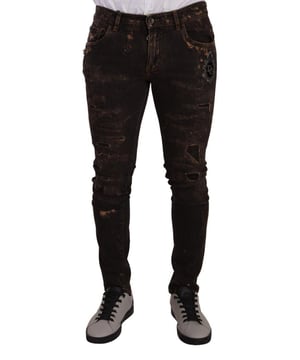 Jeans ajustados desgastados Dolce & Gabbana 100% auténticos  
Confeccionados en algodón  
Color marrón oscuro  
Corte slim  
Bordado de corona DG  
Cierre con cremallera y botón  
Detalles de logo  
Hecho en Italia  
Material: 98% algodón 2% elastano