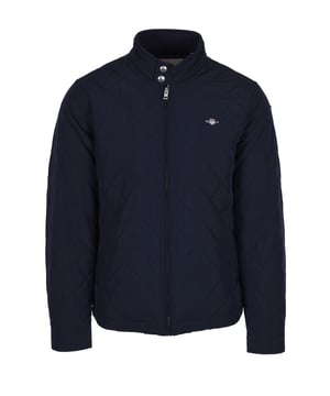 Gant Quilted Windcheater Jacket Evening Blue
Designed in a diamond quilt to add exceptional warmth, this is a great core staple of your outerwear rotation. Featuring a stand collar, elasticated hem and adjustable cuffs to ensure the perfect fit. For your every day belongings you have side welt pockets as well as two secure inside pockets. The jacket is completed with branded hardware and an embroidered GANT logo to the chest.

Fit: Regular and above hip length.
Shell and padding in recycled polyester.
Diamond quilting
Stand collar with press button closuring
Side welt pockets with hidden press button closuring
Slasticated hem
Cuffs with press button adjusters
Inside pockets 1 with press button and 1 with zip closure
Style - 7006340