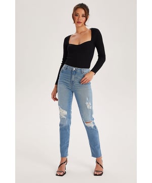 Model is 5'6 and wears a size 8. High waist. Ripped detail. Distressed detail. Front & back pockets. These jeans feature a high waist, a fitted, full-length leg and a classic 5-pocket denim silhouette. Perfect to pair with tops from our going out section for a more put together look or pair with our new sweatshirts for everyday style and comfort.