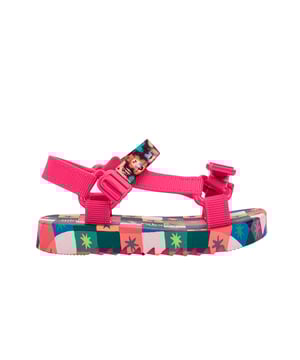 Experience unmatched fun and fashion with the Mini Melissa Playtime + Fabula - the sport sandal (papete) you never knew your mini desperately needed! The silhouette and has treaded soles and velcro straps with M logos. The insoles feature a unique, colorful print that is the perfect extra detail for a sunny day.