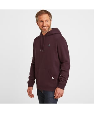 Your go-to hoody for everything from a bike ride across the moors to a trip into town or an extra layer to pop on over your gym kit, Akerman comes in a supersoft brushed back fleece finish for extra warmth and cosiness. It has a chunky hood with drawcords to keep the wind out and a generous split kangaroo pocket that doubles up as a hand warmer. This classic over-the-head hoody has a premium feel and keeps its shape for years to come thanks to generous ribbing to the cuffs, hem and pocket edge. Designed in West Yorkshire in deep colours and textures inspired by the rugged landscape, Akerman is finished with our signature small woven label on the edge of the pocket and an embroidered Yorkshire Rose badge on the chest.
