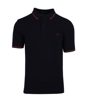 The iconic M3600 Fred Perry Polo Shirt with its legendary twin tipping is a timeless staple  elevated for the modern man. Updated with responsible features and is crafted from BCI cotton pique. This variation of the classic Fred Perry polo shirt from 1952 is cut in a contemporary fit with a slightly slimmer collar and cuff  than the original M12. This timeless polo shirt features a twin-tipped collar and cuffs with a two-button placket and short sleeves. Finished with the signature Fred Perry laurel wreath logo  embroidered on the chest.BCI - By buying BCI cotton products  you're supporting more responsibly grown cotton through the Better Cotton Initiative.-Regular Fit-Pure Cotton Pique-Twin Tipped Detailing-Rib-knit Collar with Two Button Placket-Short Sleeves with Rib-Knit Cuffs-Recycled Tipping &amp; Sewing Threads-Buttons Made from Recycled Materials-Responsibly-Sourced Laurel Wreath Embroidery-Fred Perry Branding