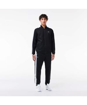 Designed for Tennis  for a regular frequency of use This poduct is made with our iconic diamond weave Taffetas. This hard-wearing fabric lends Lacoste’s tracksuits and caps a solid criss-crossed weave. Designed for freedom of movement  it is supple and lightweight  dries very quickly and doesn’t crease. This tracksuit is in 100% recycled polyester The jacket has a mesh lining and the pant a jersey lining Regular fit: natural ease on body The French Capsule offers the complete mid seasonal wardrobe on and off court with a powerful colorblocking design and its new print.