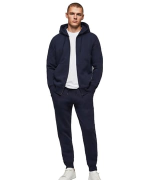 The Kruze Mens Zip Up Hoodie is a premium quality tracksuit set designed by Enzo. This regular fit zip up hoodie features kangaroo pockets and cuffed sleeves, paired with matching joggers. The elasticated waistband and adjustable drawstring are finished with a brushed back inner fleece for ultimate comfort. 52% Cotton, 48% Polyester. Available in Black, Grey and Navy colours.