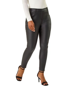 Petite Coated Pull On Jeggings from Roman. Prepare for the cooler season style with our Petite coated jeggings. Featuring a thin waistband for easy pull-on wear, these jeggings are crafted from a comfortable stretch woven fabric, offering a perfect fit for an all-day outfit. Designed with patch pockets in a trouser shape and coated appearance. Complete your look by pairing them with a trendy blouse, denim jacket, and ankle boots!
