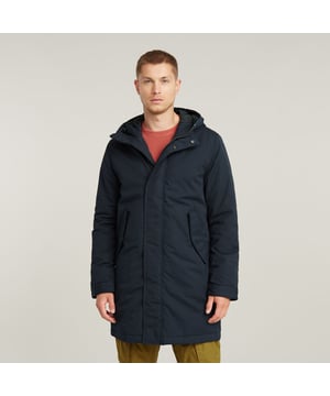 Hood, raised front with adjustable pull cords. Concealed 2-way zipper closure, hidden snap buttons. Double cuff, ribbed inner. Adjustable waist, drawcord inside. Flap pockets at the waist, hidden snap buttons. Zip & snap closure. Hooded Parka Everyday offers a straight fit. Pull the cord on the inside to emphasize the waist. This padded parka has a hood with a raised front and pull cords. Flap pockets are added to the waist. The double cuff construction blocks out the wind. 100% Cotton. Rigid. Straight