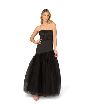 Dial up the drama during your next red-carpet appearance in this strapless gown. This formal dress features a strapless neckline, twist pleated bodice, and an asymmetrical mesh skirt. Crafted from mikado fabric, this ball gown is a nod to vintage glamor. A hidden zipper closure at the centre back completes this black-tie gown. A gorgeous look for prom or a gala, this strapless gown pairs well with simple accessories.