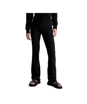 Leggings Calvin Klein Evase Jersey Milano Damen Schwarz Synthetisch. Authentisches Kleidungsstück der Marke Calvin Klein - Streetwear/Sportswear Design von Calvin Klein - Calvin Klein für Damen, perfekt für den Alltag - Die schwarzen Leggings von Calvin Klein lassen sich hervorragend mit dem Rest Ihrer Garderobe kombinieren - komfortable Synthetikmaterial - klassisch - Evase Jersey Milano -