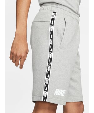 Nike NSW Sportswear Repeat Mens Fleece Shorts. 
Elastic Waistband with Adjustable Concealed Drawstring. 
Made From a Super-soft French Terry Fabric. 
Comfortable Cut Side Pockets. 
Repeat Tapes Branding Along the Legs.
80% Cotton, 20% Polyester.
Machine Washable.