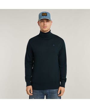 Ribbed turtle neck. Ribbed finished cuffs and waist. Structure knit above the cuffs and waist. G-Star RAW embroidery at the chest. Information label at the lower front- remove hand stitch to detach. No closure. Knitted Turtle Neck sweater Premium Core features a straight fit with a ribbed raised collar. Also the cuffs and waist are created out of a ribbed knit. A different structure is knitted straight above. The G-Star RAW embroidery at the chest signs it off. 100% Responsible Merino Wool. Comfortable stretch