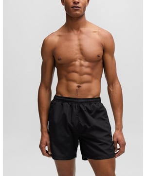 Fully lined swim shorts by BOSS, designed in quick-drying fabric with hidden drawcords, striped details and branding.
100% Polyester (recycled) , Lining: 100% Polyester
50508963