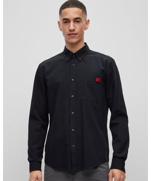 A smart-casual shirt by HUGO Menswear, topped with a button-down collar. Cut to a defined fit, this versatile shirt is crafted in washed Oxford cotton for timeless style. A red woven HUGO logo at the chest pocket adds brand DNA to this piece.
Slim fitButton-down collarPatch chest pocketsSquared cuffsStandard length
100% Cotton
50479302
