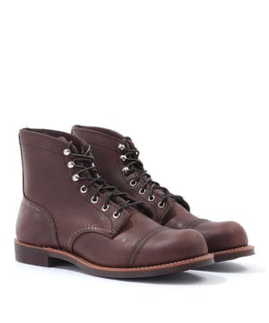 The 8111 Iron Ranger boots are a hard-wearing boot originally designed for Minnesotan iron miners  the perfect lifetime piece to add to your collection. Crafted from amber harness leather that is triple-stitched for maximum durability. Featuring a goodyear welt construction and double layered toe cap for extra strength. Finished with subtle Red Wing branding.We recommend dropping half a size to a full size - this is a rough sizing estimate.-Made in the USA-Premium Amber Harness Leather-Vibram Mini-lug Outsole-Seven Eyelet Lace Up-Triple Contrast Stitching-Red Wing Branding