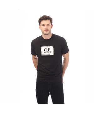 Mens C.P. Company 30-1 Jersey Label Style Logo T- Shirt in black.- Crewneck.- Short sleeves.- C.P. Company logo at the chest.- Midweight fit.- 100% Cotton.- Ref: 17CMTS029A999