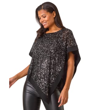 Sequin Overlay Stretch Tunic Top from Roman. Shimmer and shine in our stunning sequin overlay top, perfect for the Autumn Winter season. With a flattering round neckline and stylish short cape sleeves and hem, this top is designed in a comfortable sequin on mesh fabric that will make you stand out. The tunic shape and lavish sequin detailing make it a must-have piece for any special occasion. For a trendy fall look, pair with faux leather pants and ankle boots!