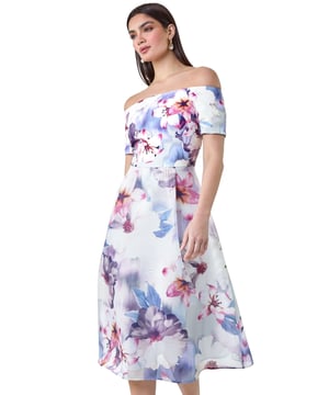 Floral Print Premium Stretch Bardot Dress from Roman. Get ready to make a grand entrance with this floral fit and flare dress from the Ariella collection. Crafted from luxe, premium stretch fabric, this dreamy fit and flare dress features a flattering bardot neckline with a scuba bodice and a woven skirt which is detailed with a burnout stripe design. Fully lined with a lavish finish, this midi-length dress has a centre back concealed zip fastening and short sleeves. An absolute wedding guest staple, pair it with strappy heels and a fascinator for the ultimate sophisticated look or accessorise with a clutch bag for a day at the races!