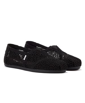 Experience ultimate comfort and style with our exquisite crochet uppers, complemented by the cutting-edge TOMS CloudBound Sole. Crafted to provide exceptional comfort, cushioning, and traction, these shoes are a true delight for your feet. The textile upper is not only trendy but also 100% vegan, making it a perfect choice for conscious consumers. With a removable insole and elastic gore for effortless on-and-off, these shoes are designed to enhance your convenience. Step into a world of comfort and sustainability with our remarkable footwear.