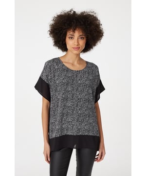 Make a statement with this leopard print poncho blouse top. It has a round neck, short sleeves, an oversized fit and a thigh length hem. Pair with fitted trousers and heeled wedges for a standout style that's perfect for date night or drinks with the girls.