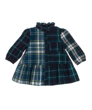 This shirt dress perfectly combines classic and modern style.

 Made of soft flannel fabric, it stands out for its checkered design in different patterns, which create an original and striking contrast.

 The round neckline, adorned with subtle gathers, adds a delicate touch, while the front button closure maintains the functional and timeless essence of this type of garment.

 It features a patch pocket on the chest, a practical and decorative style that attaches to the garment without closures or flaps.

 Long sleeves with elastic cuffs ensure a comfortable fit, and the layered skirt adds movement and a dynamic touch.

 Ideal for a casual yet stylish look, this dress is a versatile option and perfect for everyday wear.
 Composition: 100% Cotton
 Care:
- Hand wash or delicate cycle.
 - Use mild detergents.
 - Do not use a dryer.
 - Iron at low temperature.
 - Do not dry clean.