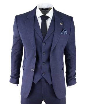 Sharp, sleek and sophisticated, look the part with this premium 3 piece Navy tweed suit, that features a slim fit cut, with a closer fit across the chest and narrower tailored trousers. the two-button jacket hangs beautifully and has a half canvas construction that moulds to your body shape the more you wear it. Contrasting flap pockets, buttoned cuffs and a double back vent lend the suit a classic touch of refinement. A matching tweed waistcoat completes the 3-piece with a single breasted down style with classic tailored pockets and a back adjuster to ensure you can create your ideal fit. The suit is evergreen and contemporary at the same time and allowing you to look the best all day. Pair it with a matching waistcoat, a white shirt and shoes for a dapper finish.