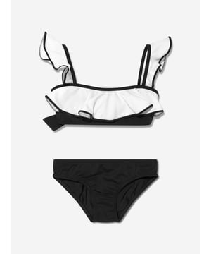 Introducing the chic Girls Oppa Ruffle Bikini in Black by Nessi Byrd, an exquisite addition to your little girl's swim collection.  Opulent Design: The all-black colour adds a dose of sophistication, while the ruffle details offer a playful and stylish flair. Superb Comfort: Crafted from the finest materials, this bikini guarantees a gentle touch on your girl's tender skin during water escapades. Picture-Perfect Swimwear: Turn beach days into a fashionable event with this Girls Oppa Ruffle Bikini in Black from Nessi Byrd. Amplify your girl's swim style by ordering now!