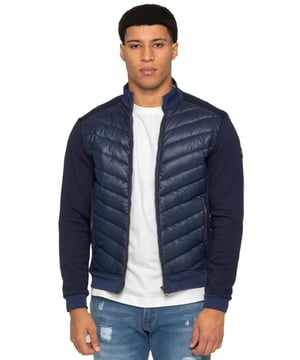 Enzo Milano Mens Hybrid Jacket features a puffer front made from lightweight polyester, which provides excellent insulation. Full zip fastening front with a elasticated collar, long contrast-fabric sleeves with elasticated cuffs. The jacket has 2 secure zip-fastening pockets, 2 inside pockets for additional storage. Finished with Enzo Milano rubberised branding on the left sleeve.