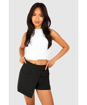 A pair of shorts that resemble a skirt...what more could a girl want? Designed to give you a bit more freedom while still looking cute, this skort is the perfect combination of style and practicality. From floaty skorts for summer days to white skorts perfect for showing off those bronzed pins, just team with chunky trainers and a crop top and your go-to off duty look is sorted. Summer styling has literally never been this easy. From trending cargo skorts to floaty printed options, shop it all on boohoo.Style: SkortsFabric: PolyesterLength: Short