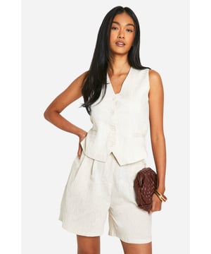 Say hello to your new style obsession - waistcoats! These versatile pieces take tailored sophistication to the next level. Whether you're keeping it casual with jeans, glamming up with a midi skirt, or going for a sleek matching look with straight-leg trousers - our range of women's waistcoats has got you covered. Featuring classic button fastenings and a fit that is designed to enhance all silhouettes, no matter your shape! From cropped to longline to asymmetric styles, the options are endless. Find your perfect match right here at boohoo!Style: WaistcoatDesign: PlainFabric: Linen lookLength: RegularSleeve Length: Sleeveless