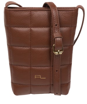 The 'Elouise' cross body phone bag from the Pure Luxuries Marylebone collection is handcrafted from high-quality, genuine Nappa leather with a natural super-soft touch. The eye-catching quilted design on the front gives the bag a unique silhouette, along with extra protection. A concealed magnetic closure keeps the contents of the bag secure. The interior is lined with 100% cotton and includes a slip pocket and two card slots. Comes with a matching and adjustable slim leather strap with a maximum drop length of 65cm. The minimalist Pure Luxuries logo is embossed in gold foil for a beautifully simple finishing touch.