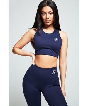 inchNavy Essential Gym BraletteSofttouch fabricRound neckSikSilk LogoRacerbackRegular fit  true to sizeMachine wash88% Nylon 12% Elastane inch
