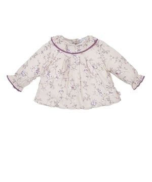 Girl's long sleeve blouse.
 Round lapel collar.
 Button closure at the back.
 Elastic and ruffled cuffs.
 Flared cut.
 Matching visible seams and floral print.
 Composition: 100% Viscose.
 Care:
Wash at a maximum temperature of 30ºC.
 Iron at medium temperature, max. 110ºC.
 It is not allowed to use a dryer.
 Do not use bleach.
 Does not support dry cleaning.