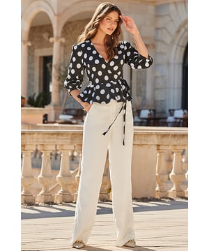 Life tip: buy the top
Nothing flatters like a wrap top
You'll love the waist-cinching peplu, hem
Framed by gorgeous blouson sleeves
Polka dots always look chic
Style with a denim midi for an on-trend outfit