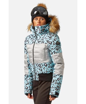 The Surfanic Fiore ski and snowboard jacket is a popular street-styled high-performance mountain jacket for all occasions. Classic feminine design with premium warmth, this low loft puffer jacket is filled with 100% recycled insulation that warms up as quickly as it dries out, for all-day comfort. This street-styled block gives you the right mix of form and function.

The Surftex 10K outer shell provides excellent waterproof protection from the winter elements, while the 10K breathability rating allows body heat and moisture to escape through the fabric for optimum comfort throughout the day. The jacket's shell fabric has a high-performance durable coating with taped seam construction that offers exceptional heat retention in cold conditions and a high level of breathability that ensures excess heat doesn't form into condensation on the inside of the jacket.

The detachable hood has a 3-way volume adjuster for increased all-round visibility when you are flying down the mountain and require the added protection of having your hood up and when the weather offers you a challenging day. The water-resistant front zipper has an internal reinforced storm flap for increased comfort and protection.

Powder skirt - Whether you're hitting the powder on skis or snowboard, this snow skirt creates a tight seal around your waist to keep the snow out and the warmth in. Made from durable waterproof materials and an internal dry butt patch (DBP) to keep it all warm and dry.

Snow cuff / wrist gaiter - This is perfect for even the most extreme conditions, featuring a tight seal that bridges the gap between your glove and jacket.

Zipped pockets - Pockets designed for everything plus a few more just in case. Pockets for goggles, lift pass, media, stash pocket for cash, wallet pocket and inside phone pocket for protection and to keep the battery warm and dry. Plus a detachable goggle wipe for those days when visibility is at a premium.

Design features:

    Detachable fur
    3-way volume adjusting hood
    Super soft chin guard
    Zipped sleeve ski pass pocket
    Snow cuffs with thumb loop
    Media pocket
    Goggle pocket
    Mesh-lined pit zips
    Detachable goggle wipe
    Twin zipped tricot lined hand warmer pockets
    Reinforced internal storm flap
    Waterproof snow skirt
    Dry butt patch (DBP)

Fabric & performance:

    Bomber fit
    Shell 100% polyester
    Water resistant coating 10,000mm
    Breathbility rating MVP 10,000 gm²

Insulation & lining:

    100% recycled polyester low loft insulation.
    Insulation. 80 gm² body 40 gm² Sleeves
    Lining 100% recycled embossed polyester.