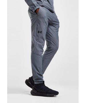 From the streets to the workout, rep these men's Vanish Track Pants from Under Armour. - - . These track pants are cut from smooth, durable poly fabric for lasting wear. - -. Comes In a Black and Grey colourway, they feature an elasticated waistband, with woven ankle cuffs to secure the fit. - -. Finished up with Under Armour branding around the cuffs, and a signature logo at the thigh. Machine washable. - -. Our model is 6'0" and wears medium size.