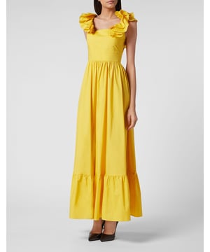 Verstärken Sie Ihre Eleganz für Ihre besonderen Anlässe mit diesem romantischen langen Kleid. Sehen Sie sich die Details an.   Baumwoll-Popeline   Die gerüschten Träger am engen Mieder überkreuzen sich am unteren Ende des V-Rückens   Langes Band zum Binden auf dem Rücken in einer großen Schleife am Bund   Logoaufnäher auf der rechten Seite   Volant am unteren Saum