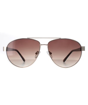 Guess Aviator Womens Gold Brown Gradient GF0414  Sunglasses feature a stylish, oversized frame made from high-quality acetate, providing a bold yet elegant look while ensuring durability and comfort. The lenses offer superior UV protection, effectively shielding your eyes from harmful rays and reducing glare. Adorned with the signature Guess logo on the temples and available in a variety of modern color options, the GGF0422 sunglasses add a touch of glamour to any outfit.