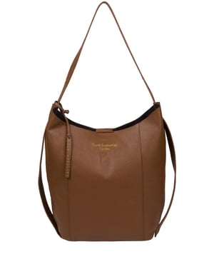 The 'Hoxton' shoulder bag is crafted from natural gold-standard leather for a unique and distinct finish that will evolve with time. As part of Pure Luxuries Essentials Collection, this style is free from polyester linings and plastic zips for an eco-friendly accessory. This style comes unlined with a robust and hard wearing central compartment with an exposed, soft to the touch leather interior. This bag is secured with a magnetic claps and decorated with hanging straps and the finishing touch is the gorgeous Pure Luxuries leather charm and embossed logo.
