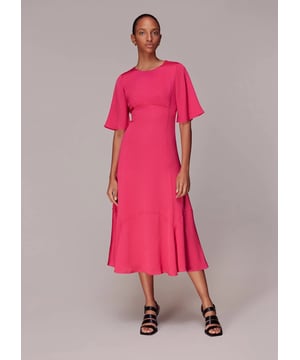 Embrace elegance with the Alana Satin Dress, a stunning pink midi perfect for any soirée. Crafted from 100% recycled polyester, this eco-conscious piece features a chic cut-out design and short sleeves. Its flowing silhouette ensures a flattering fit for all, making it an ideal choice for your next evening out.