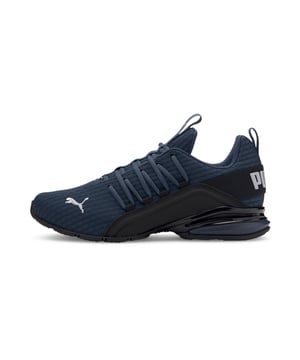 PRODUCT STORY Be bold in the game-changing silhouette of our Axelion Block Running Shoes, which combine contemporary design with the supreme comfort of our foam heel unit for the last word in athletic style. DETAILS   Low boot   Textile upper   Foam heel   TPU shank   Rubber outsole   PUMA Cat Logo at toe