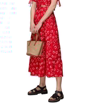 Brighten up your daywear with this vibrant Red Floral Tiered Midi Skirt. Its eco-friendly fabric and cheerful floral tie dye print make it perfect for a leisurely weekend outing or a casual meet-up with friends.