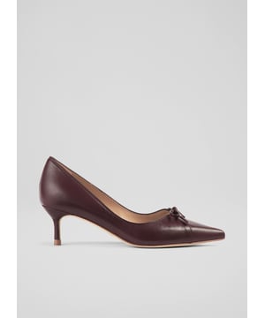 The perfect kitten heel court, our Missy court shoes take on rich, autumnal colour and feminine detailing. Crafted in Spain from wine-hued red leather, they have chic pointed toes, peek-a-boo cut-out and bow detail and delicate 50mm kitten heels. Wear them with sleek winter suiting or a simple pair of tailored trousers.