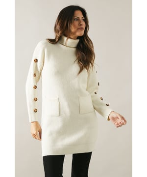 High neck design for a sophisticated look
        Buttoned sleeve detail adds a touch of elegance
        Tunic length offers versatile styling options
        Front patch pockets for practicality and style
        Ribbed knit texture for added visual interest
    
    This Wallis high neck tunic is the epitome of casual sophistication. The ribbed knit texture and tunic length create a flattering silhouette, while the buttoned sleeve detail adds a touch of refinement. Perfect for those who appreciate comfort without compromising on style, this versatile piece can be dressed up or down with ease. For a chic daytime look, pair it with sleek leather-look leggings and knee-high boots. Alternatively, style it with tailored trousers and pointed flats for a more polished ensemble suitable for family gatherings or casual work environments. The front patch pockets offer both practicality and style, making this tunic an ideal choice for the woman who values both form and function in her wardrobe. Embrace the cooler seasons with this cosy yet stylish piece that effortlessly bridges the gap between comfort and elegance.