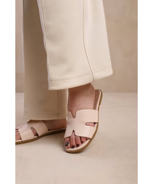 Introducing our Strap Sandals with Front Strap Detail - the perfect combination of style and comfort. These sandals are designed to elevate your everyday looks with their sleek design and fashionable front strap detail.
Key Features:


Stylish Front Strap Detail: These sandals feature a chic front strap detail that adds a trendy and modern touch to your outfit. The unique design sets these sandals apart and instantly enhances your fashion game.

Comfortable Fit: We prioritize your comfort, and these sandals are no exception. The soft straps gently hug your feet, providing a secure and comfortable fit. The flat sole ensures all-day comfort, making these sandals perfect for long walks or casual outings.

Specifications:

Material: Faux Leather
Design: Featuring a stylish front strap detail that adds a touch of sophistication.

Elevate your everyday style with our Strap Sandals with Front Strap Detail. These sandals seamlessly combine fashion and comfort, allowing you to step out in confidence. Whether you're running errands or meeting friends for a casual outing, these sandals will effortlessly enhance your look. Upgrade your footwear collection today with these fashionable and comfortable sandals.