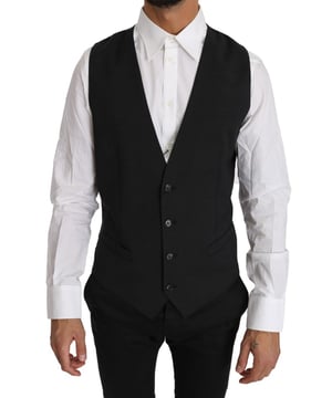 Marke: Dolce & Gabbana  
Modell: Anzugweste  
Schnitt: Slim Fit  
Farbe: Grau  
Vollständiger Knopfverschluss  
Logodetails  
Hergestellt in Italien  
Material: 100% Wolle