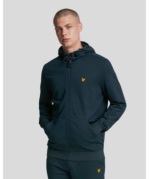 Using lightweight and soft feel viscose, our Full-Zip Fly Fleece Hoodie is a more contemporary, sports version of the classic zip-up hoodie with added stretch.- 70% viscose 22% polyamid 8% elastane- Full body, tonal rubber-tipped zip- Thick drawcord- 360 gsm fabric- Relaxed cuff and hem- Set-in sleeves- Split Kangaroo Pocket