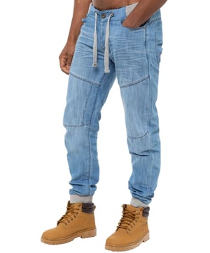Enzo Mens Cuffed jogger jeans. Printed branding on the front and back. Branded buttons, rivets and trimmings. Overall profile stitched, creasing on front and back. Cotton blend, Cut and sew panelling. Waist adjustable drawstrings.