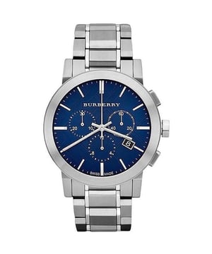 Introducing the Burberry Watch, model BU9363, a seamless blend of style and functionality. This timepiece features a stunning blue dial housed within a classic stainless steel case and bracelet, offering a modern twist on traditional elegance. The chronograph subdials provide added utility, while the date window at the 4 o'clock position is a nod to practical design. Crafted with Swiss precision, the watch is equipped with a quartz movement, ensuring reliable timekeeping. It is an accessory that serves not only as a functional timepiece but also as a statement of sophistication and a mark of impeccable taste. Specification Details Brand Burberry Model BU9363 Barcode Number 822138040211 Gender Unisex Case Diameter 42 mm Case Material Stainless Steel Case Colour Silver Dial Colour Blue Band Material Stainless Steel Band Colour Silver Movement Swiss Quartz Water Resistance 5 ATM Features Chronograph, Date Indicator