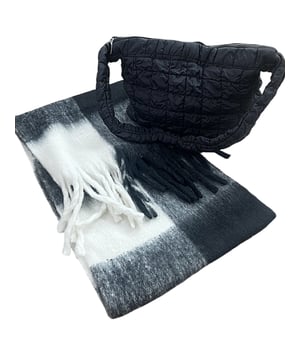 Stay warm and stylish this winter with the Chunky Black and White Check Scarf Bag Everyday Essential Bundle by SVNX. This statement accessory features a bold black and white check pattern with a cozy, chunky knit. Perfect for adding a touch of modern style and warmth to your winter outfits, this scarf effortlessly combines fashion and function. A matching bag to go with the Scarf making your outfits even easier. Perfect for gifting or getting yourself a matching set. Bag Colour: Black. Material: 100% Polyester. Bag Size: W - 45cm H - 35cm. Bag Care: Wipe Clean Only. Bag SKU: HB326202. Unisex Chunky Scarf in Black and White Check. Scarf: One Size. 100% Polyester. Wash at 30. Scarf SKU: SC2303902. Bundle SKU: BD2400101